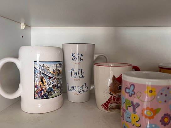 A Shelf Full Of Various Mugs 8-9
