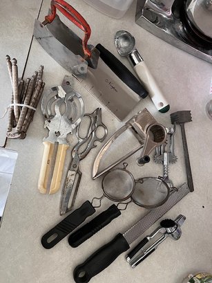 A Group Of Vintage Everyday Kitchen Utensils Including Choppers, Strainers, Opener, Grater Etc