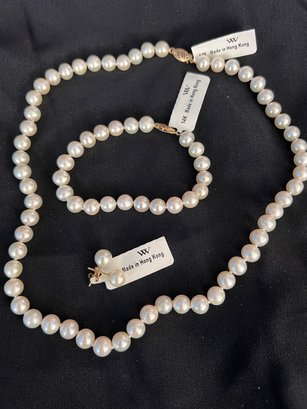 A Three Piece Set Of Pearls With 14K Clasps
