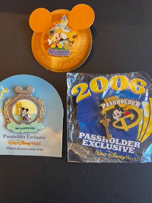 A Group Of Three Disney Pass Holder Exclusives NEW
