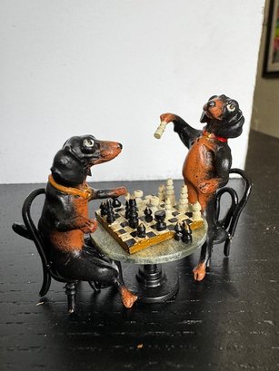 A Pair Of Dachshunds Playing Chess