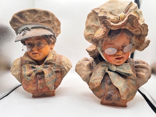 A Pair Of Austrian Busts Of Young Children With Glasses Numbered