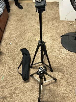 A Pair Of Adjustable Tripods