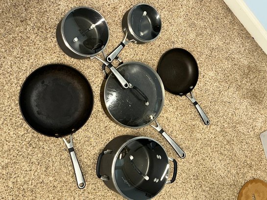 A Set Of Calphalon 6 Pots And Pans With Covers As Shown