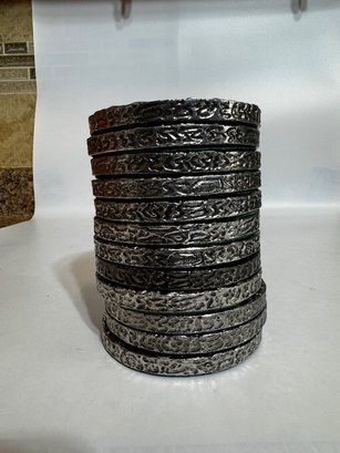 A Group Of 12 Pewter And Cork Coasters