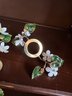 Multiple Sets Of Enamel Dogwood Flowers Over Brass Candle Toppers