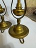 A Group Of 4 Brass Hanging Ship Candle Holders
