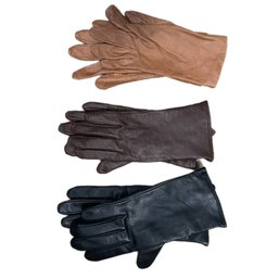 Black, Tan, And A Blue Grey Set Of Gloves