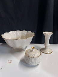 A Group Of Three Lenox Porcelains Sugar Bowl, Serving Bowl And Candle Stick