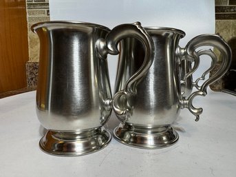 A PAIR OF HANDLED CUPS BY WOODBURY PEWTER