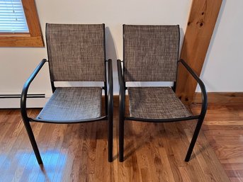 A Pair Of Outdoor Patio Chairs In Chocolate Brown
