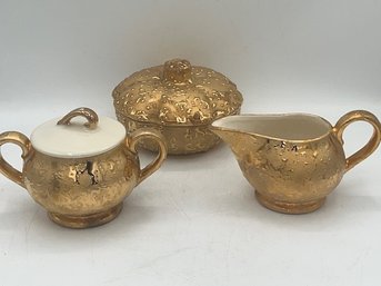 A Three Piece Porcelain Creamer. Sugar And Covered Bowl 24kt