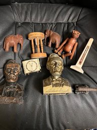 2 Lincoln Banks, Elgin Clock, 2 Teak Elephants, An Articulated Wooden Monkey, Thermometer And Hour Glass