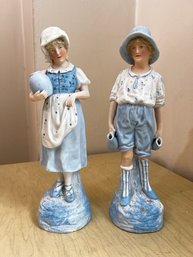 Pair Of Bisque Figurative Statues