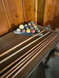 6 Vintage Pool Cue Sticks And A Rack Of Balls