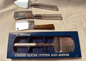 A Group Of 4 Cheese  Knives