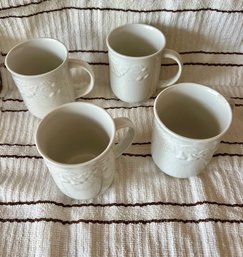 A Group Of 4 White Ceramic Mugs By Oneida