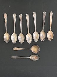 A Group Of Demitasse Spoons And One Sterling