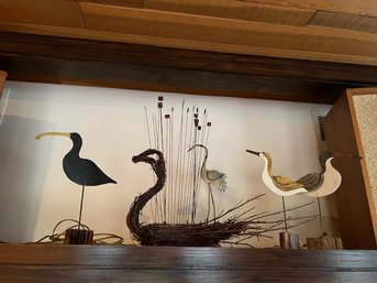A Group Of Birds And Sea Grass In Wood And Metal