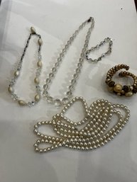 A Group Of Crystal Necklaces And Faux Pearl