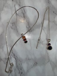 A Pair Of Sterling Silver With Amber Necklaces And Semi Precious Stones
