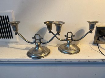 A Pair Of Pewter Double Arm Candle Sticks