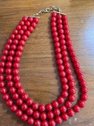 A Monet Red Large Bead Three Strand Necklace