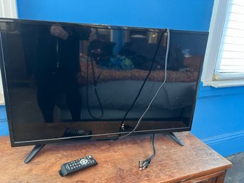 An Insignia TV With Remote