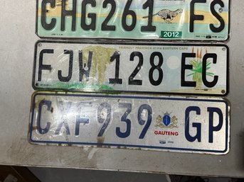 A Group Of 3 Foreign License Plates