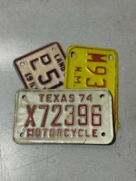 A Group Of 3 Motorcycle License Plates 74, 81 And 92