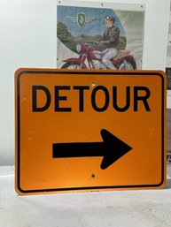 Orange And Black Detour Sign With Arrow
