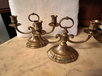 A Pair Of Brass Candelabras