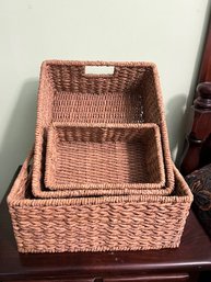 A Set Of Three Woven Rattan Boxes