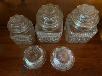 3 Glass Covered Jars And 2 Extra Lids