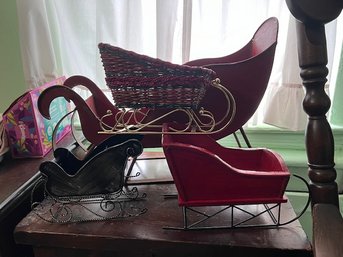 A Group Of 4 Retro Sleds For Holiday Decoration