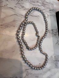 A Pair Of Grey Pearls, Bracelet And Necklace