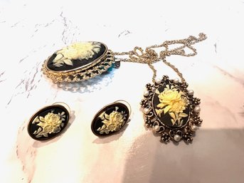 An Ensemble Of Black And White Cameo Like Pin, Earrings And Necklace