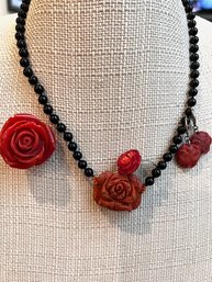 A Group Of Red Rose Jewelry Ensemble, Necklace, Ring And Earrings