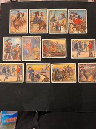 A Group Of 12 Wild West Hassan Cigarette Cards