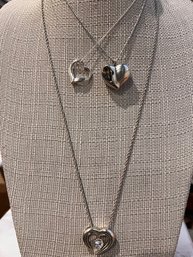A Group Of Three Sterling Silver Heart Pendents On Sterling Chains
