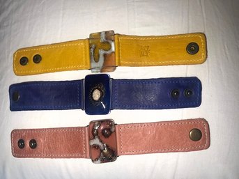 A Group Of Three Fused Glass And Leather Snap Bracelets