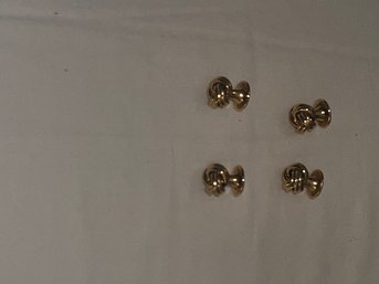 A Group Of 4 Gold Tone Knot Studs