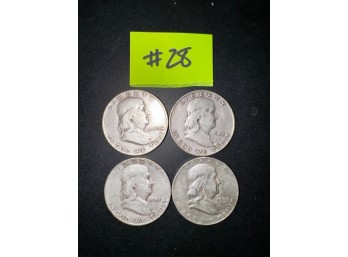 A Group Of 4 Benjamin Franklin Half Dollars