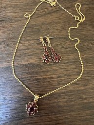 A Necklace And Earring Set Gold Tone With Garnet Stones