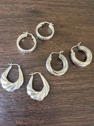 A Group Of Three Retro Sterling Silver Hoops