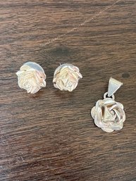 A Pair Of Sterling Silver Floral Earrings And Matching Pendent