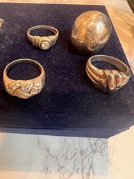 A Group Of 4 Sterling Silver Rings