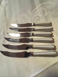 A Set Of 6 Porcelain Handled Cheese Knives