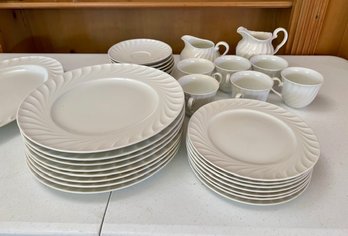 A Set Of White Dinnerware With Many Serving Pieces, Including Platters, Sugar And Creamers, Bowls Etc