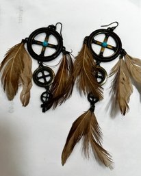 A Pair Of Feather Earrings One Missing Lower Feather